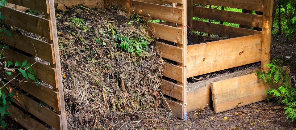 A compost bay made of pallets