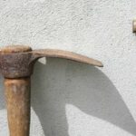 Old mattock and wooden handled garden tool